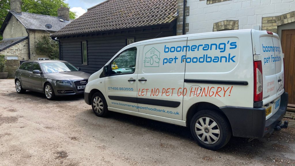 Boomerang's Pet Foodbank white van showing side livery with slogan "let no pet go hungry!"